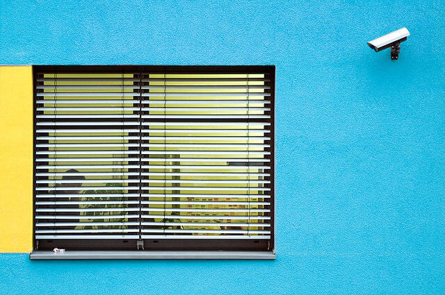 A CCTV camera pointed at a window.